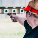 Woman sighting handgun