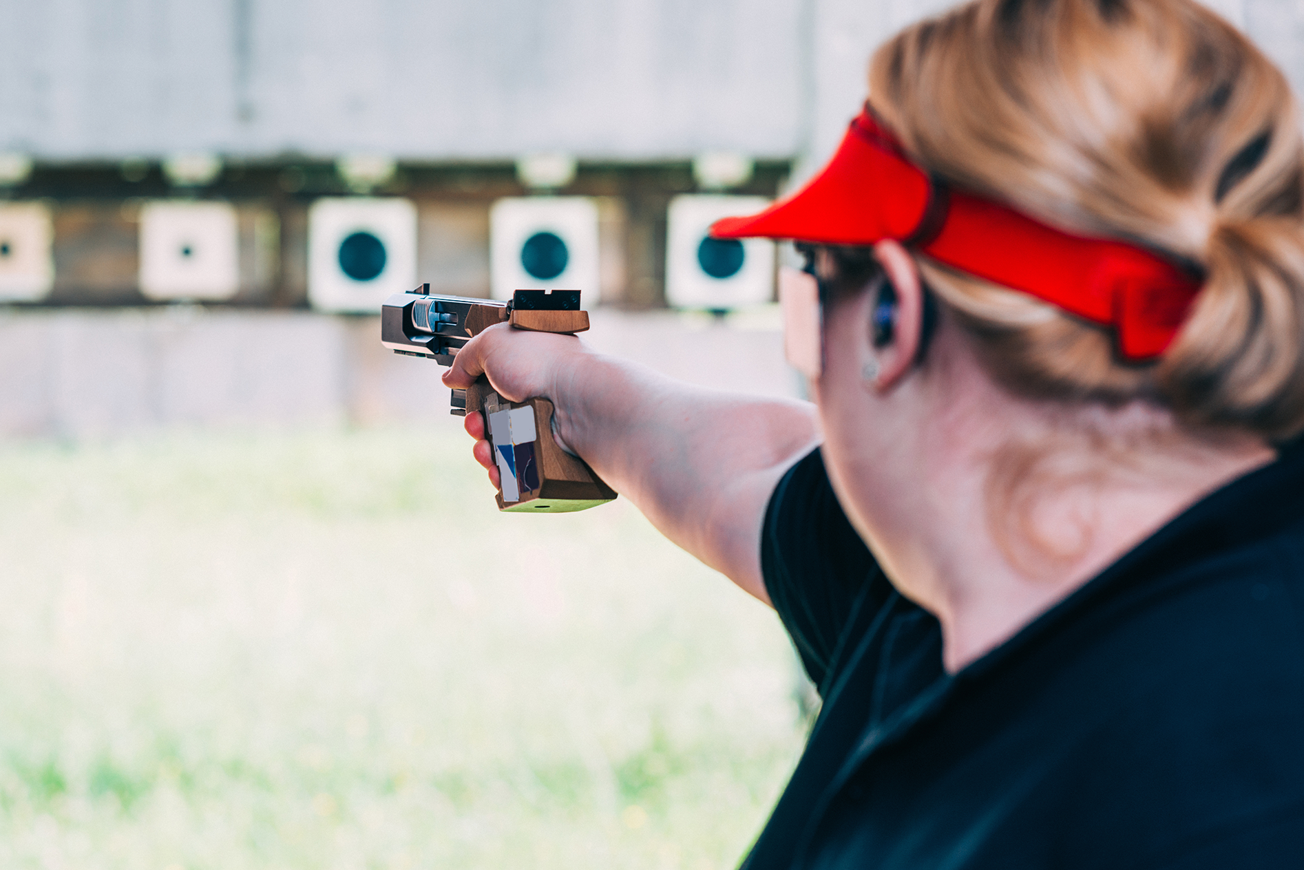 Woman sighting handgun